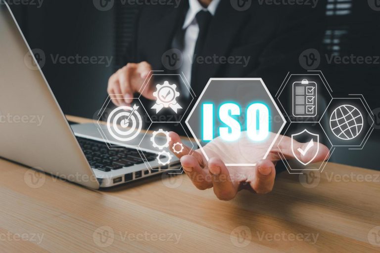 iso-standards-quality-control-concept-person-hand-holding-iso-icon-on-virtual-screen-on-desk-workplace-assurance-warranty-business-technology-concept-photo